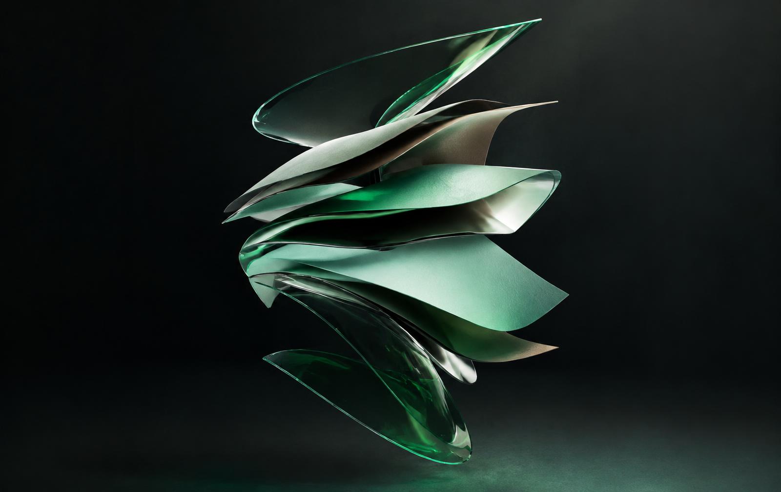 Sculptural layers of glass, chrome, and colored paper
